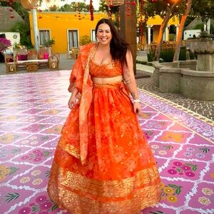 Vibrant Orange Lehenga with Gold Accents